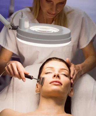 dermatologist-performing-laser-hair-removal-patient