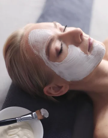 face-maskbeautiful-young-girl-spa-cosmetician-woman-applying-facial-mask