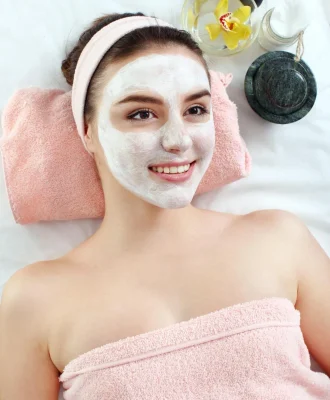 hardware-cosmetology-closeup-picture-lovely-young-woman-with-cream-mask-beauty-parlour (1)